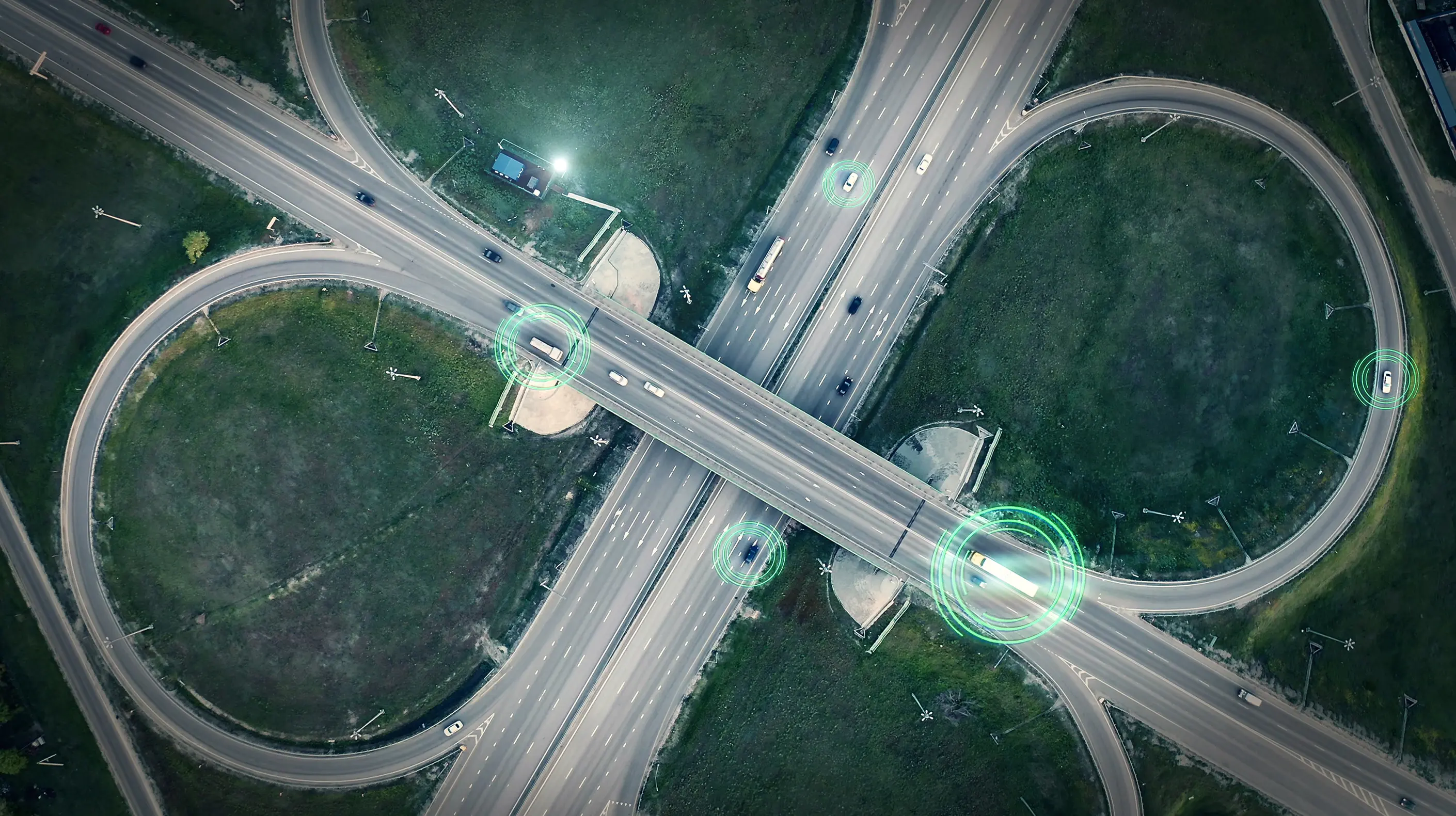 Aerial shot of vehicles being tracked with smart fleet telematics on a highway.