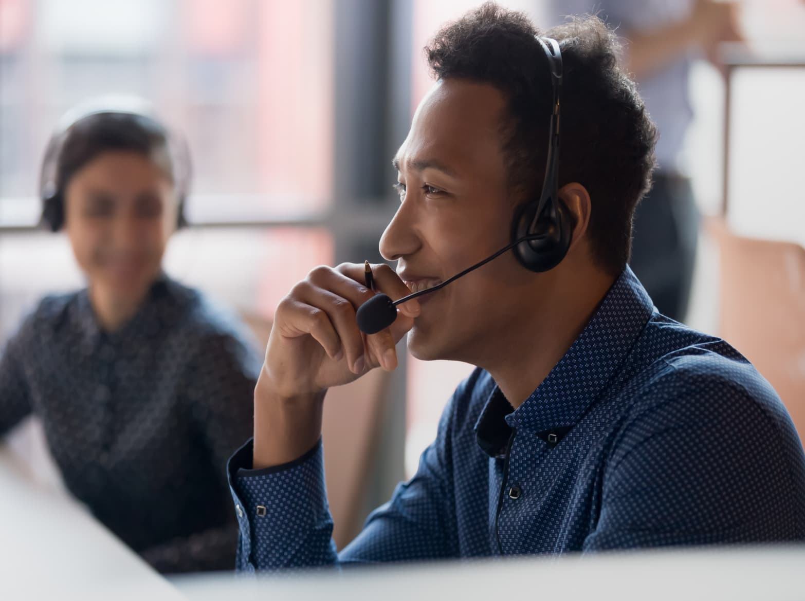 A person using a headset while working.