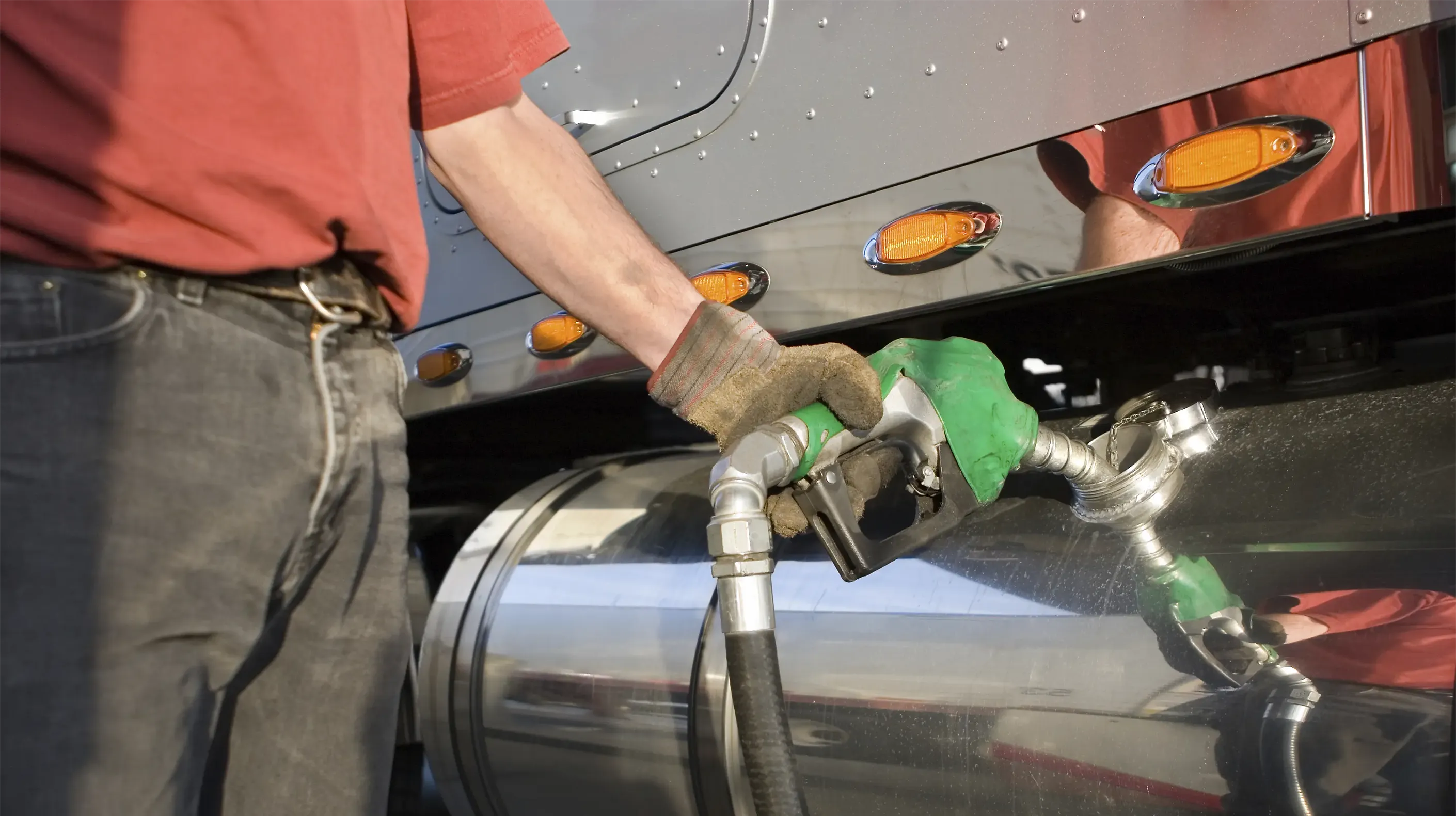 Closeup of a person filling up the fuel of their truck.
