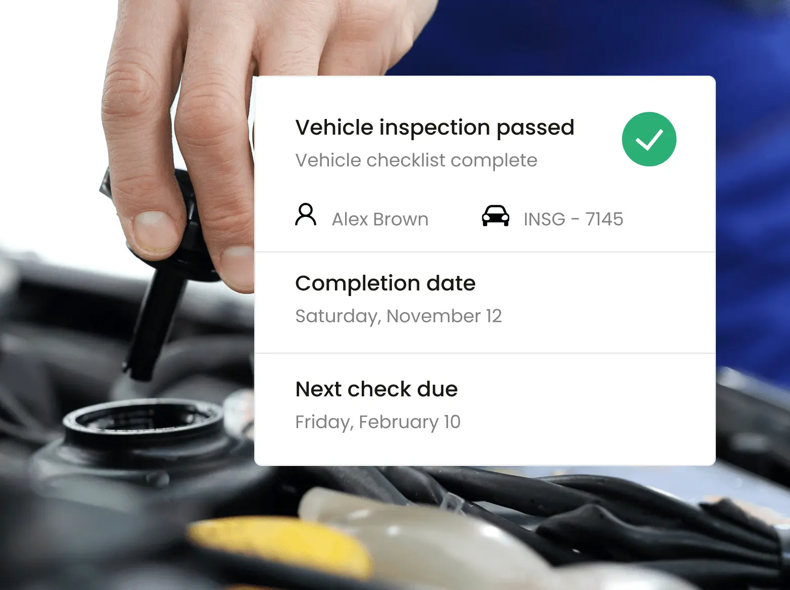 Closeup of a worker doing inspections on a vehicle with Inseego's fleet tracking software showing alerts about it.