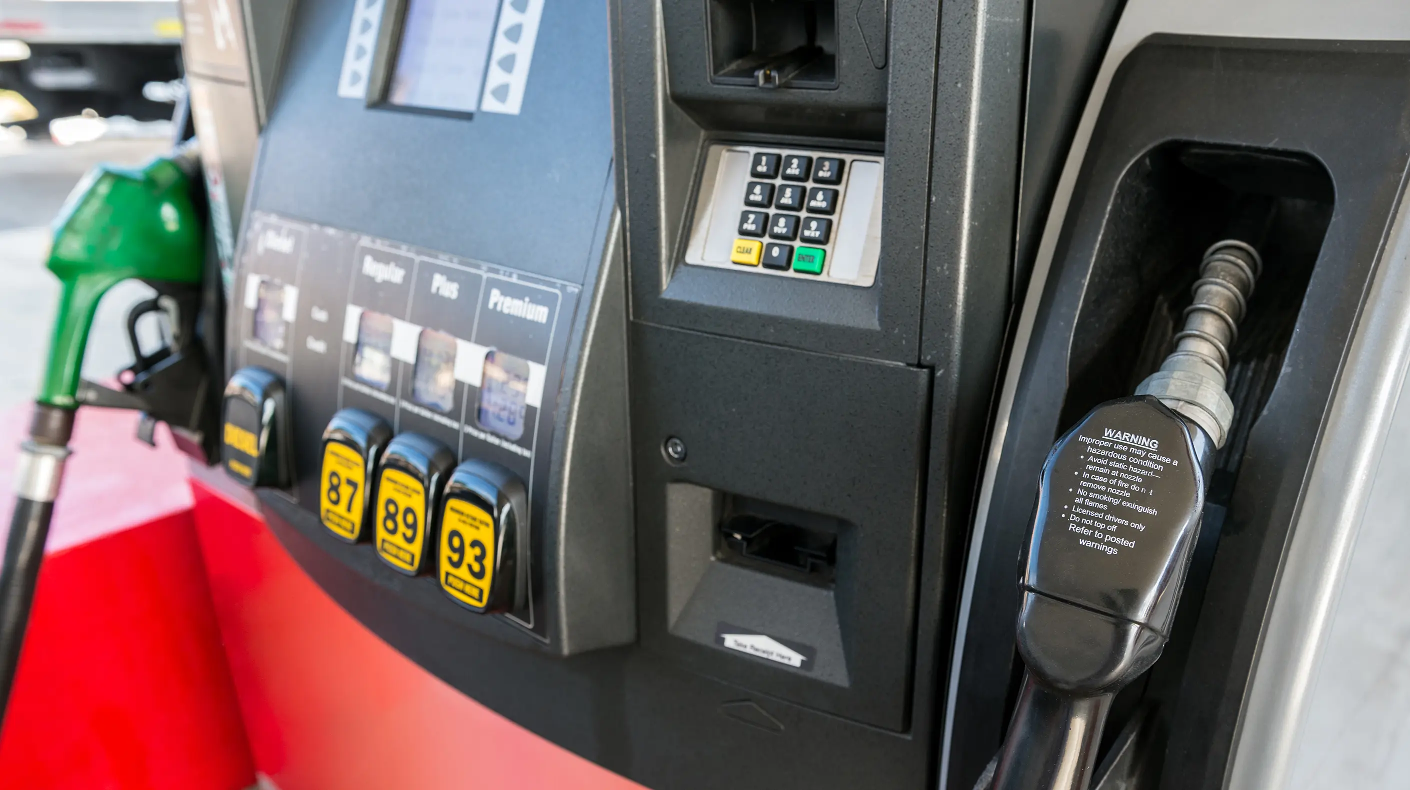 Closeup of a gas pump with different types of fuel available.