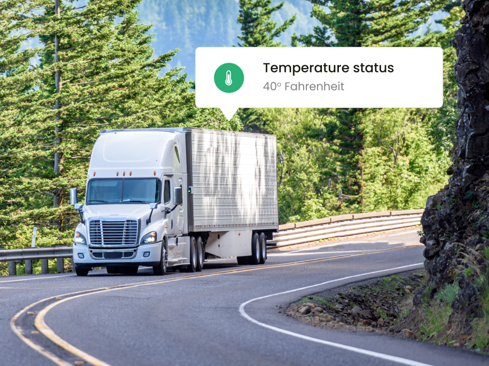 Picture of a truck driving down a road with a text box on the top right of picture showing the temperature.